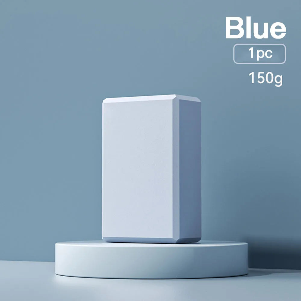 Solid colour EVA foam yoga block showing hexagonal facets with ridges, measuring 23x15x7.6cm