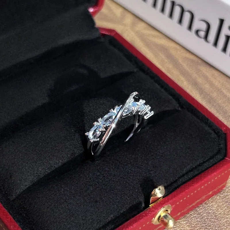 Copper geometric star river track ring with inlaid zircon stones in blue diamond colour, open style on hand