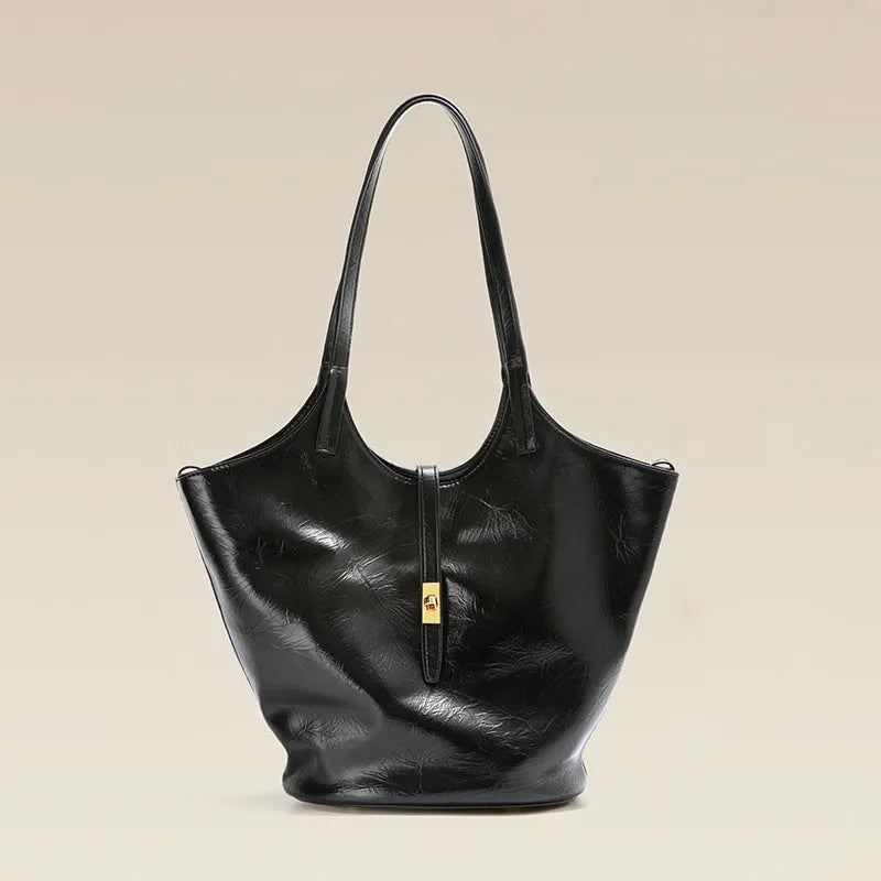 Black genuine leather bucket bag with sewing thread detail and single shoulder strap