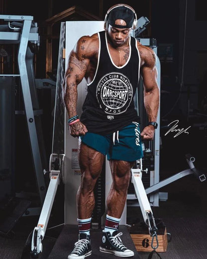 Men's casual running shorts in black, navy blue, wine red, and army green, featuring breathable wicking fabric.