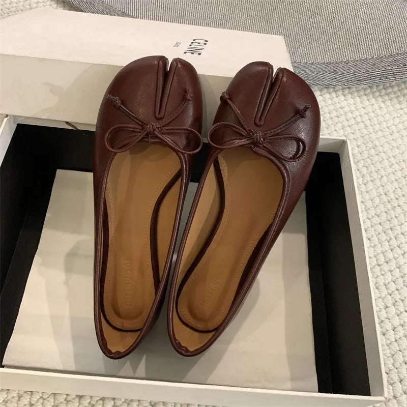 Women's split-toe flats in beige colour showing round toe design and slip-on style with shallow vamp cut