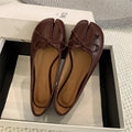 Women's split-toe flats in beige colour showing round toe design and slip-on style with shallow vamp cut