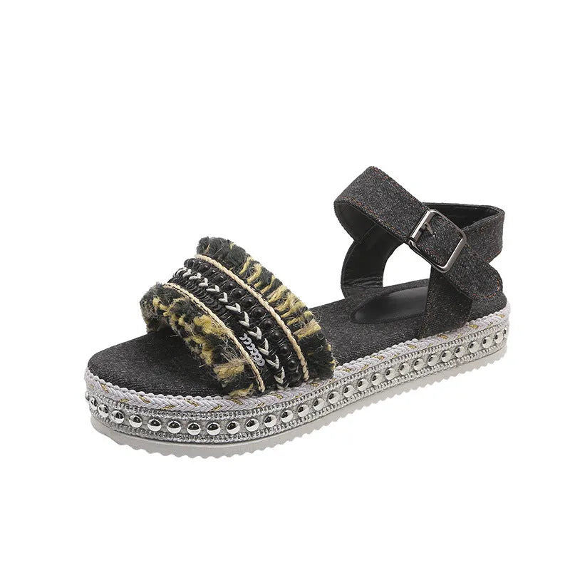 Women's tassel denim sandals with thick flat sole and buckle closure in blue