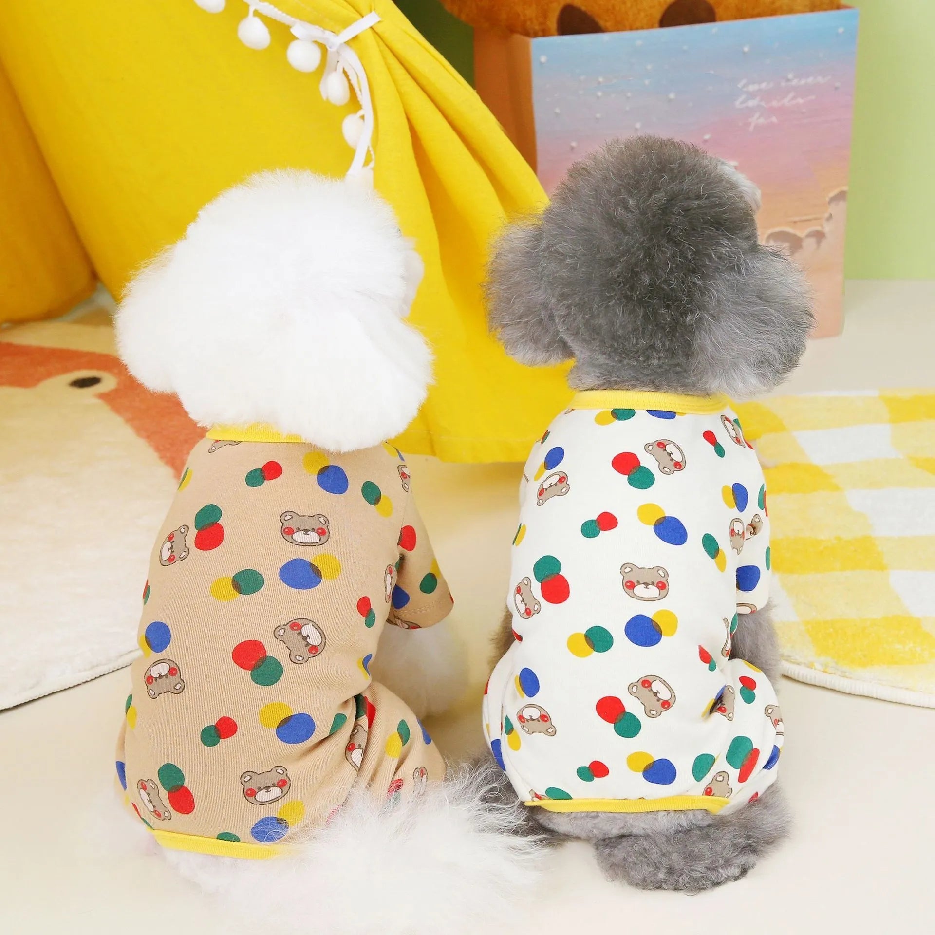 Beige dog costume with colourful ball bear design, made from cotton and spandex blend.