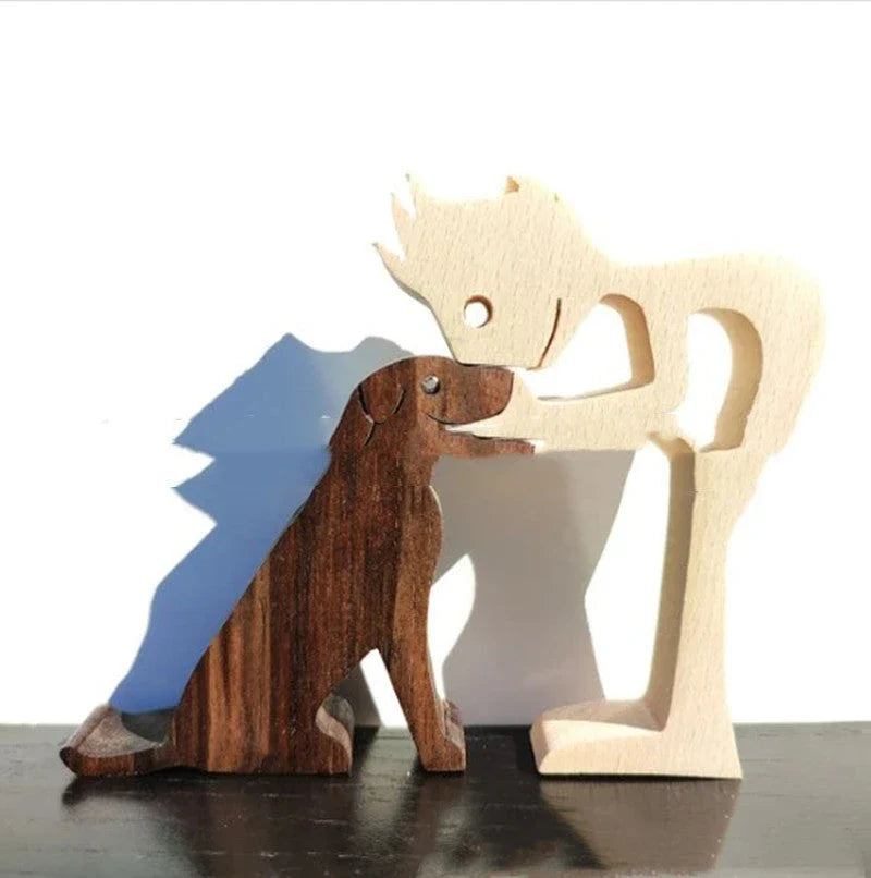 Handcrafted wooden dog sculpture featuring a man and his loyal canine companion