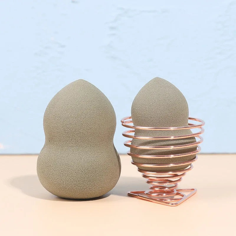 Four Hydrophilic Polyurethane beauty eggs in assorted colours on a metal stand, size 6x4cm each