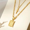 Double layered necklace with letter charm, square cross pendant, and melon seed buckles on adjustable chain