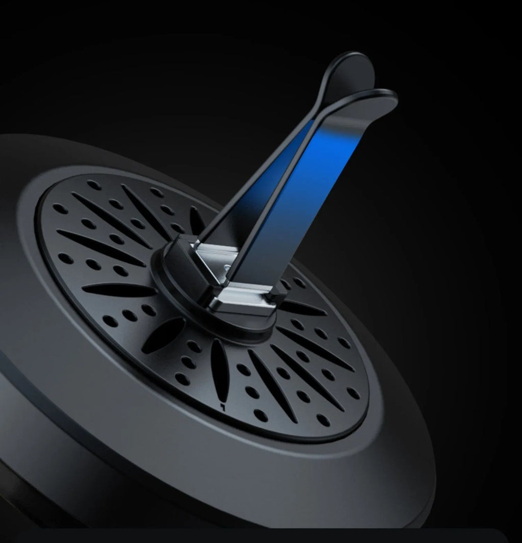 RGB car air outlet aromatherapy light with 3D rhythm effects mounted in a car vent.