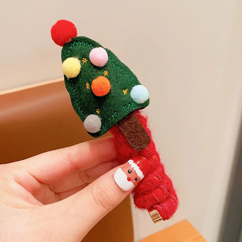 Festive Christmas hair ties for girls in various holiday-themed designs, including red bells, green trees, and khaki deer.