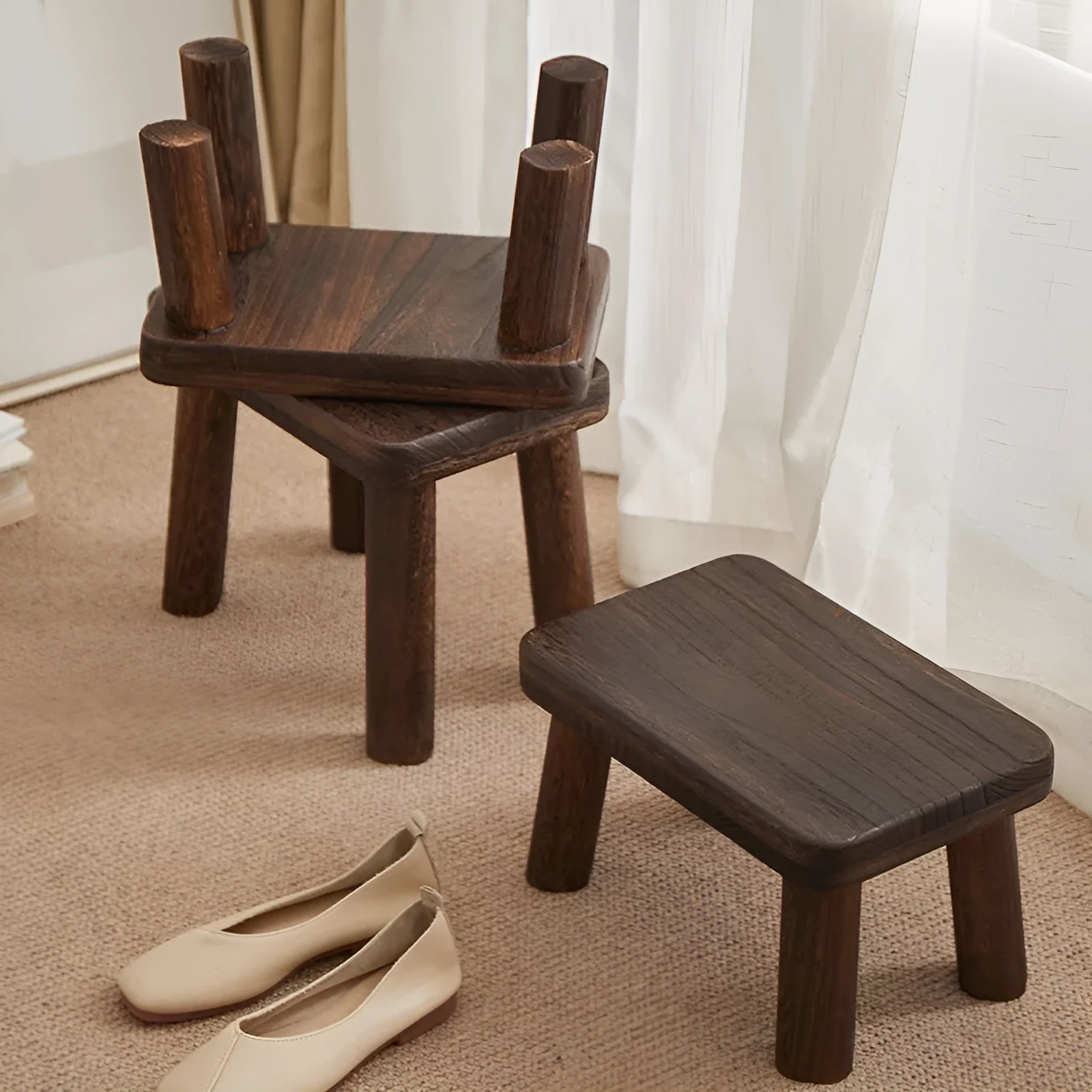 Solid wood household shoe changing stool with a distressed finish and bracket structure legs.