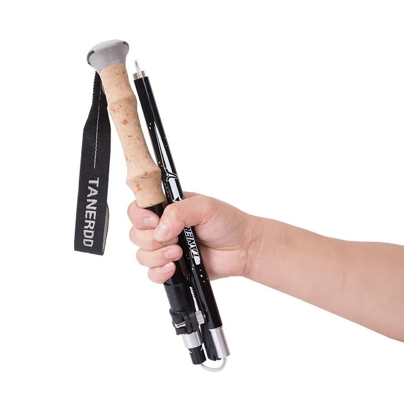Retractable carbon fibre hiking pole on a rocky trail, set to medium height