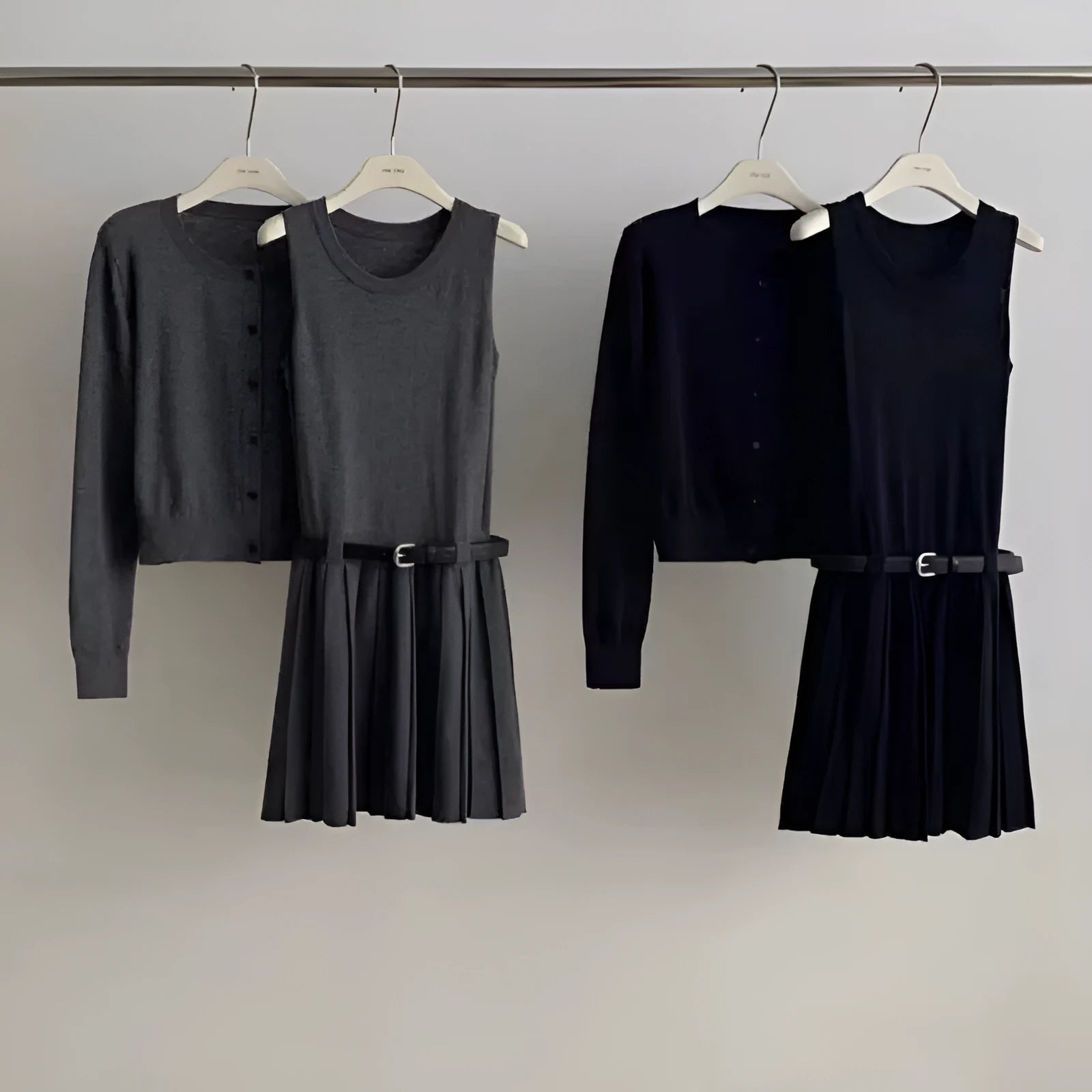 Women's grey art retro knitted vest skirt and long-sleeved cardigan two-piece set with belt.