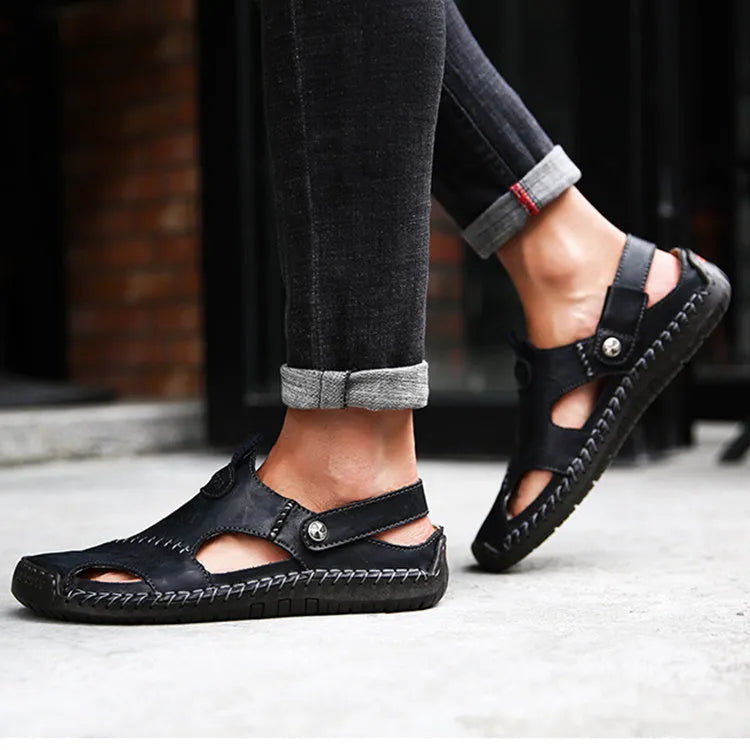 Men's closed toe sandals in black with rubber sole and adjustable slide strap