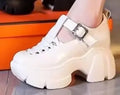 Women's satin closed toe pumps with wedge heel and skull pattern in black or creamy-white