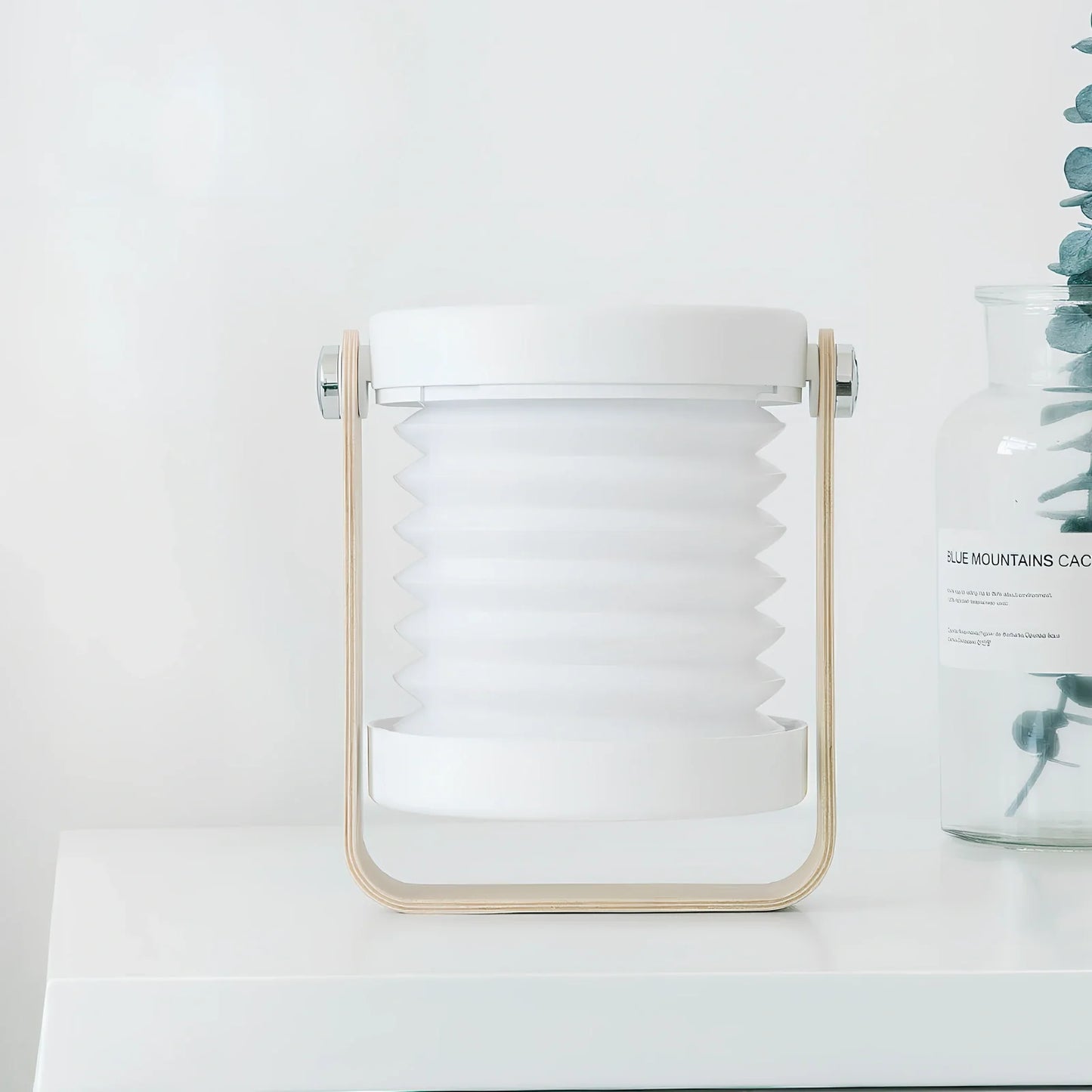 USB rechargeable lantern night light with touch dimming and 360-degree rotation in white finish