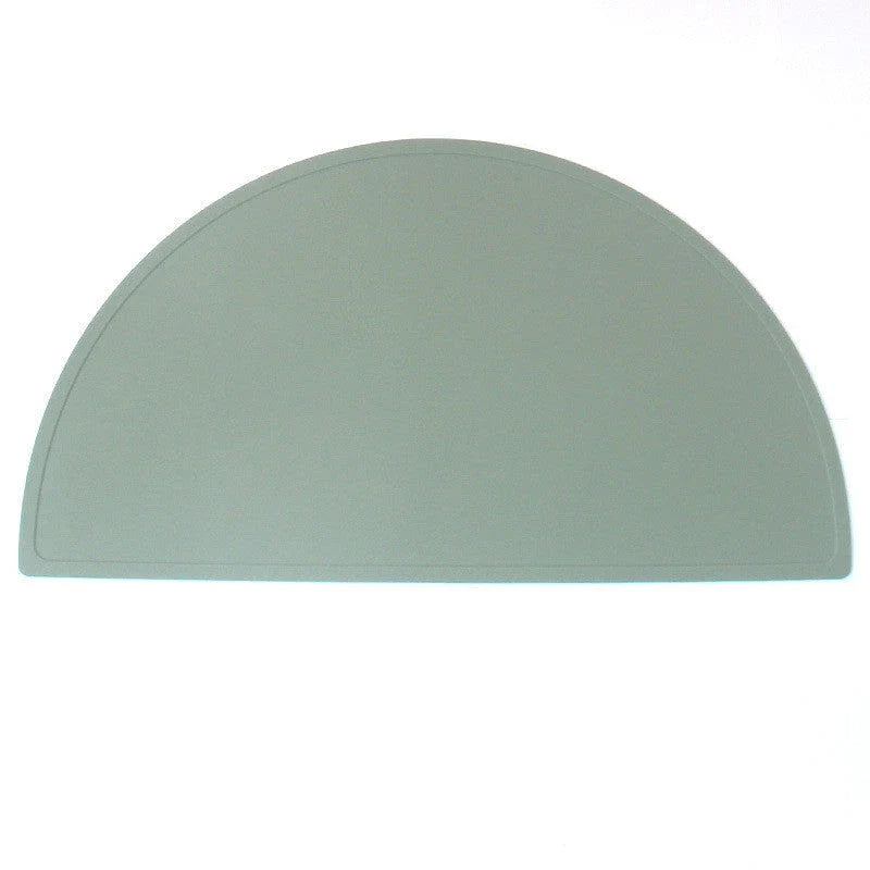 A durable, food-grade silicone placemat in various colours, suitable for Kiwi kids' mealtimes.