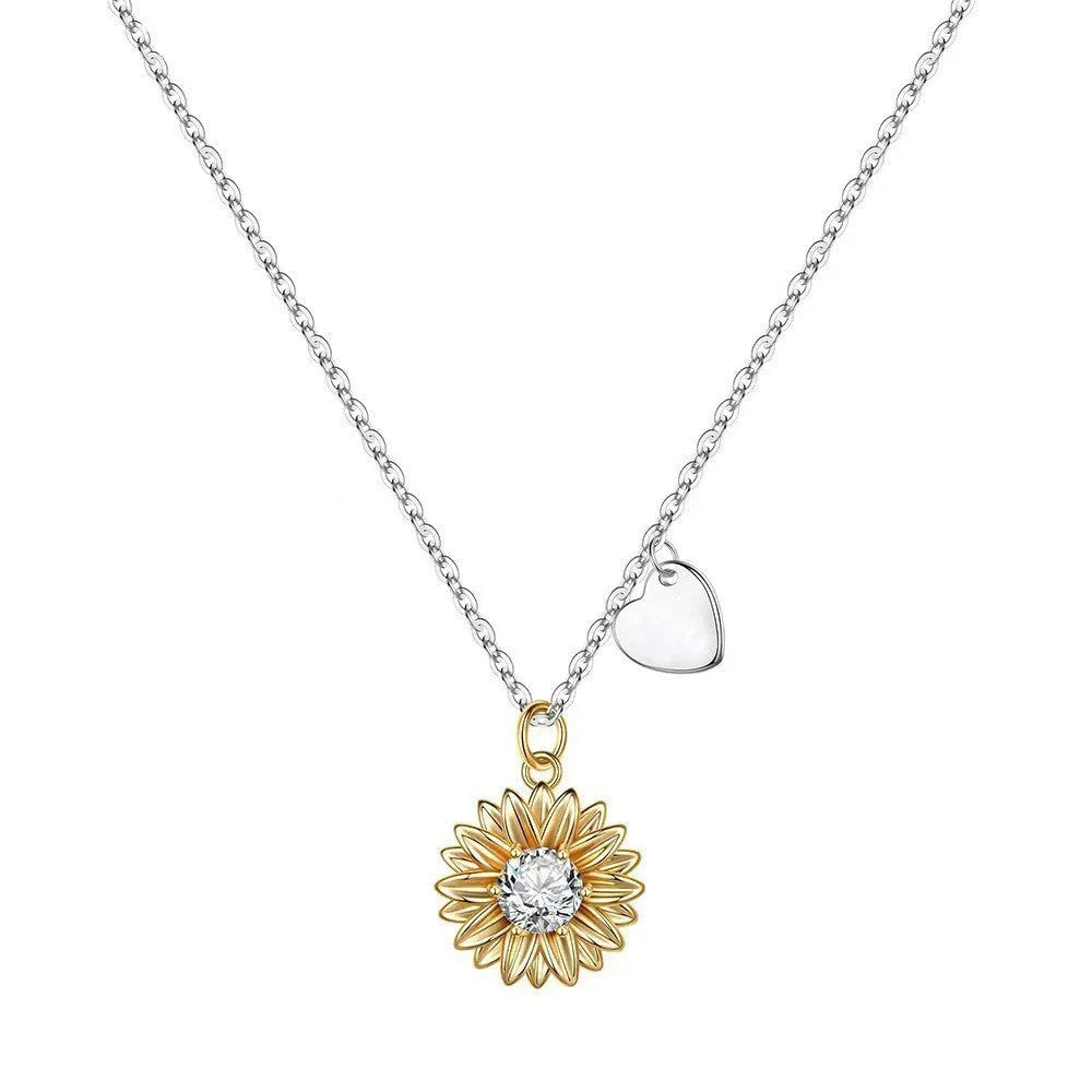 925 sterling silver sunflower necklace with daisy petal details on an adjustable cross chain.