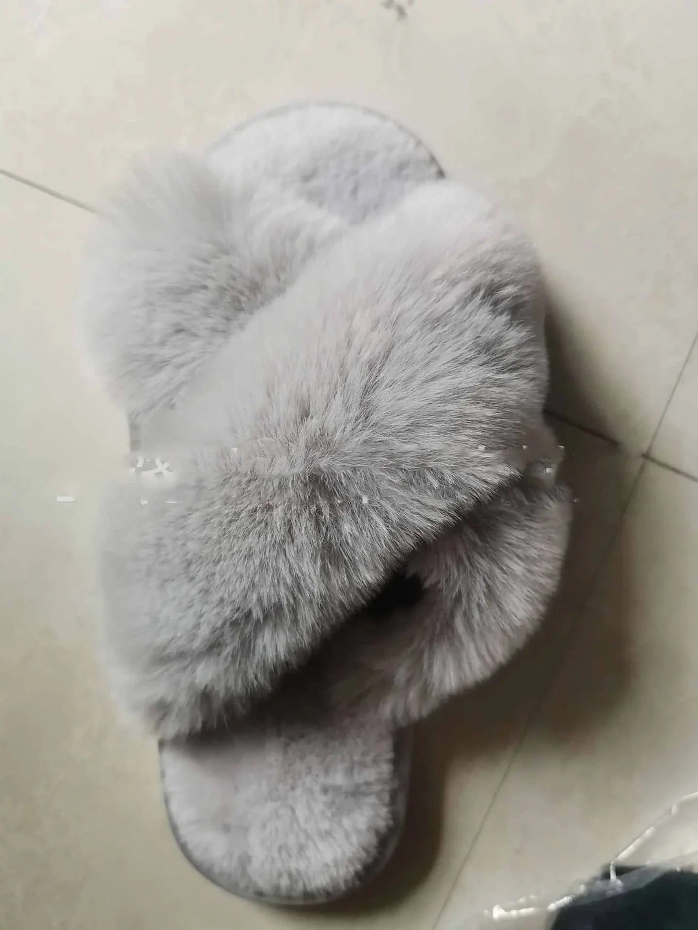 Cozy faux fur cross slippers for women in various colors, featuring a stylish design and plush, comfortable material