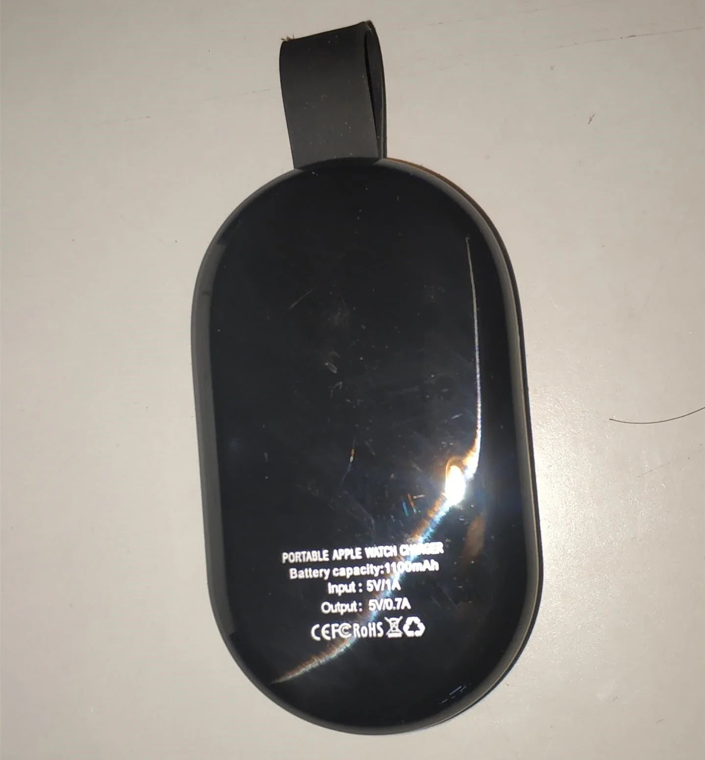 Sleek white wireless fast charger with USB interface for efficient device charging