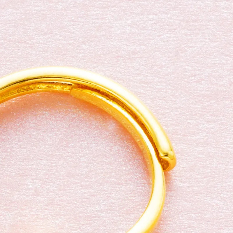 Women's adjustable copper ring with zircon stone in six colour options on a white background.