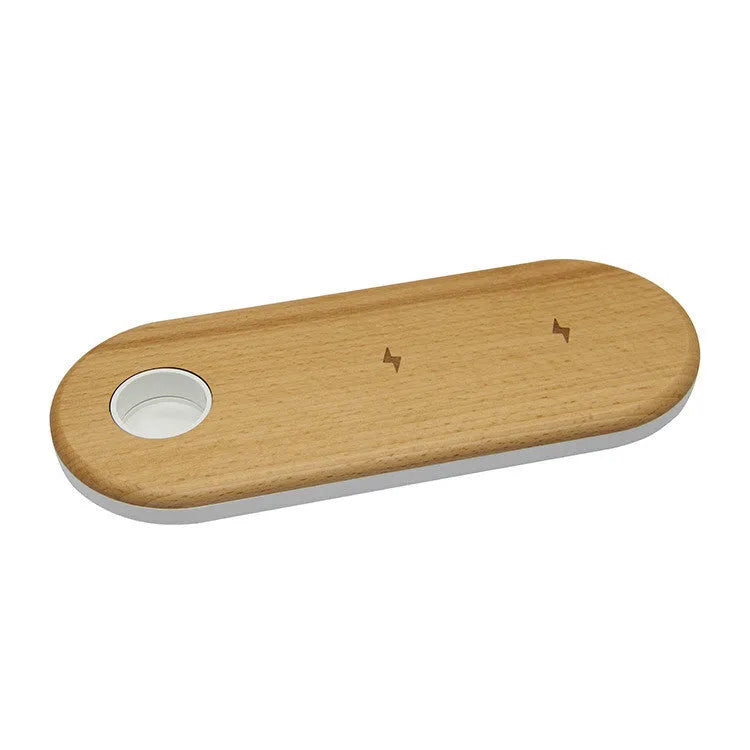A wooden wireless charging pad made from bamboo with beech wood edging on a desk.
