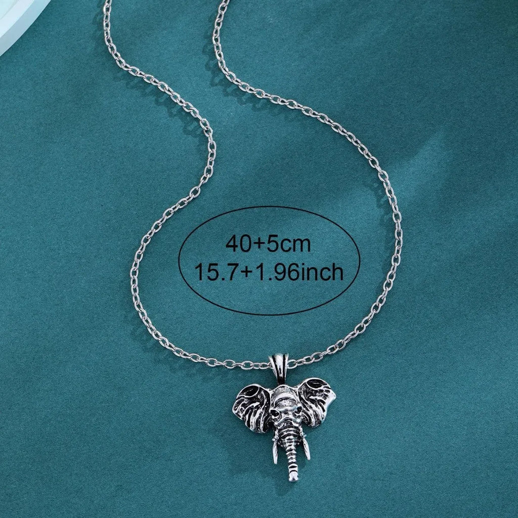 Silver and black elephant god pendant necklace on display, stainless steel construction for men.