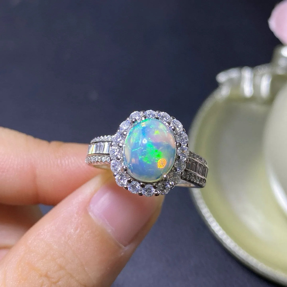 Handmade adjustable opal ring on a sterling silver open band with gold tone plating.
