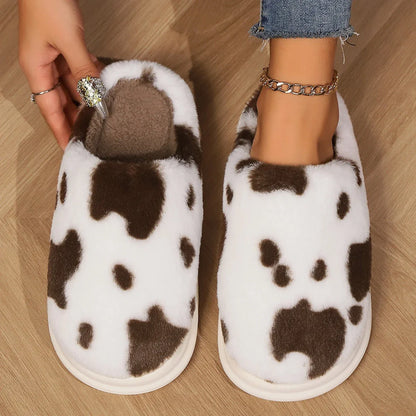 A pair of cozy, plush slippers with a unique spotted pattern, designed for warm and comfortable indoor wear.