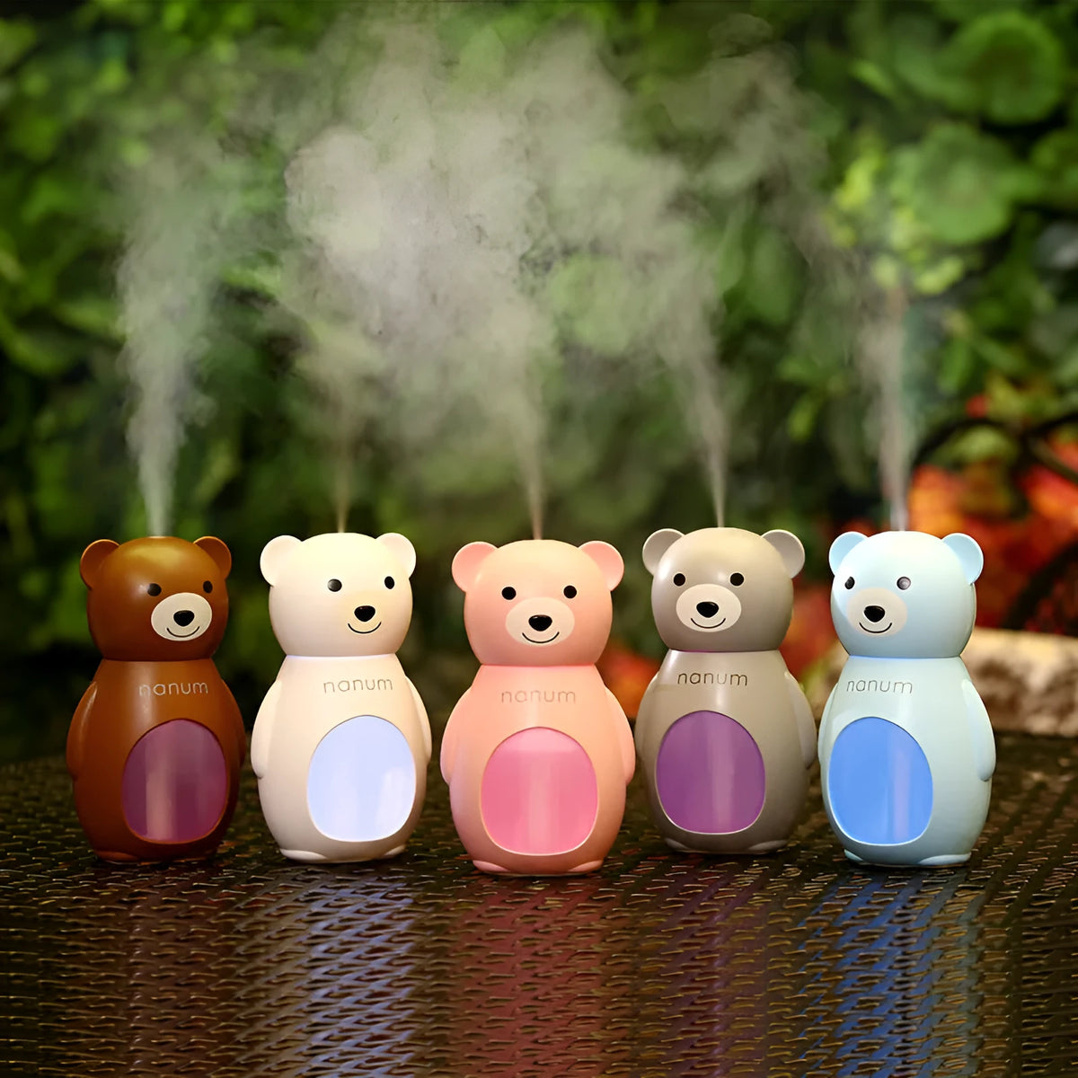 Animal-shaped USB mini humidifier in white plastic with single mist outlet and mechanical timer knob on a desk.