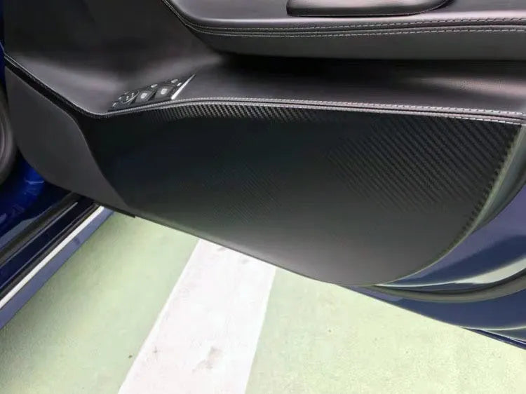 Carbon fibre pattern protective film for Tesla Model S door panels showing four pre-cut pieces