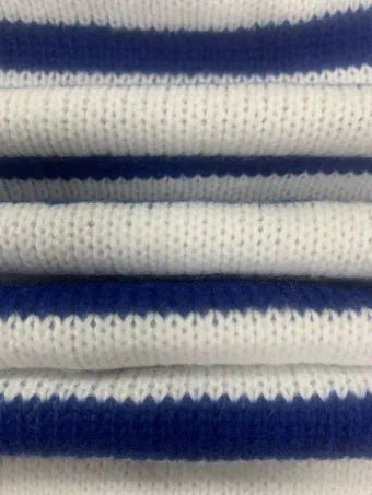 Sapphire blue striped loose fit pullover sweater with round neck and long sleeves on a hanger.