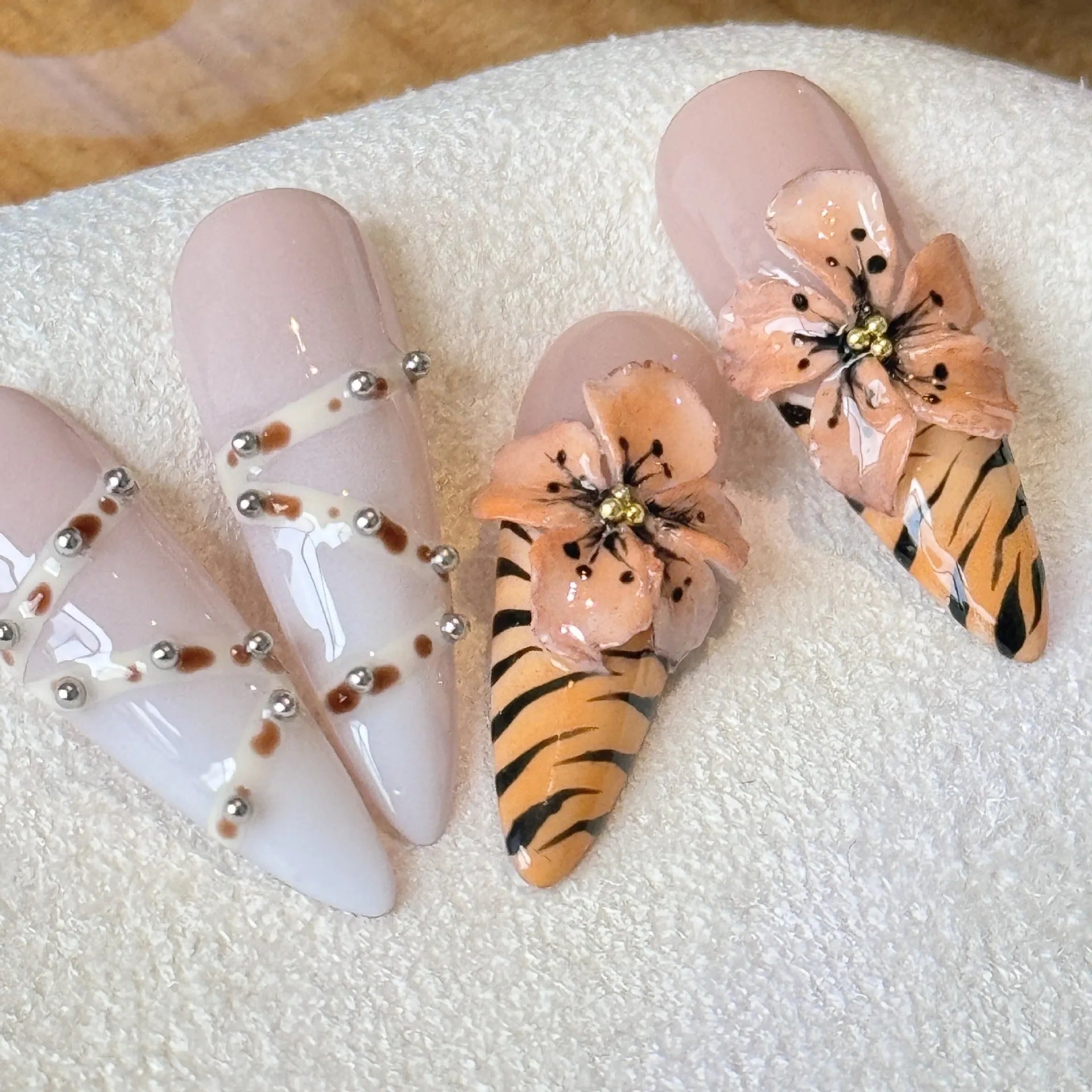 Pack of 10 leopard print, floral, and cross pattern nail stickers in sizes XS, S, M, L.
