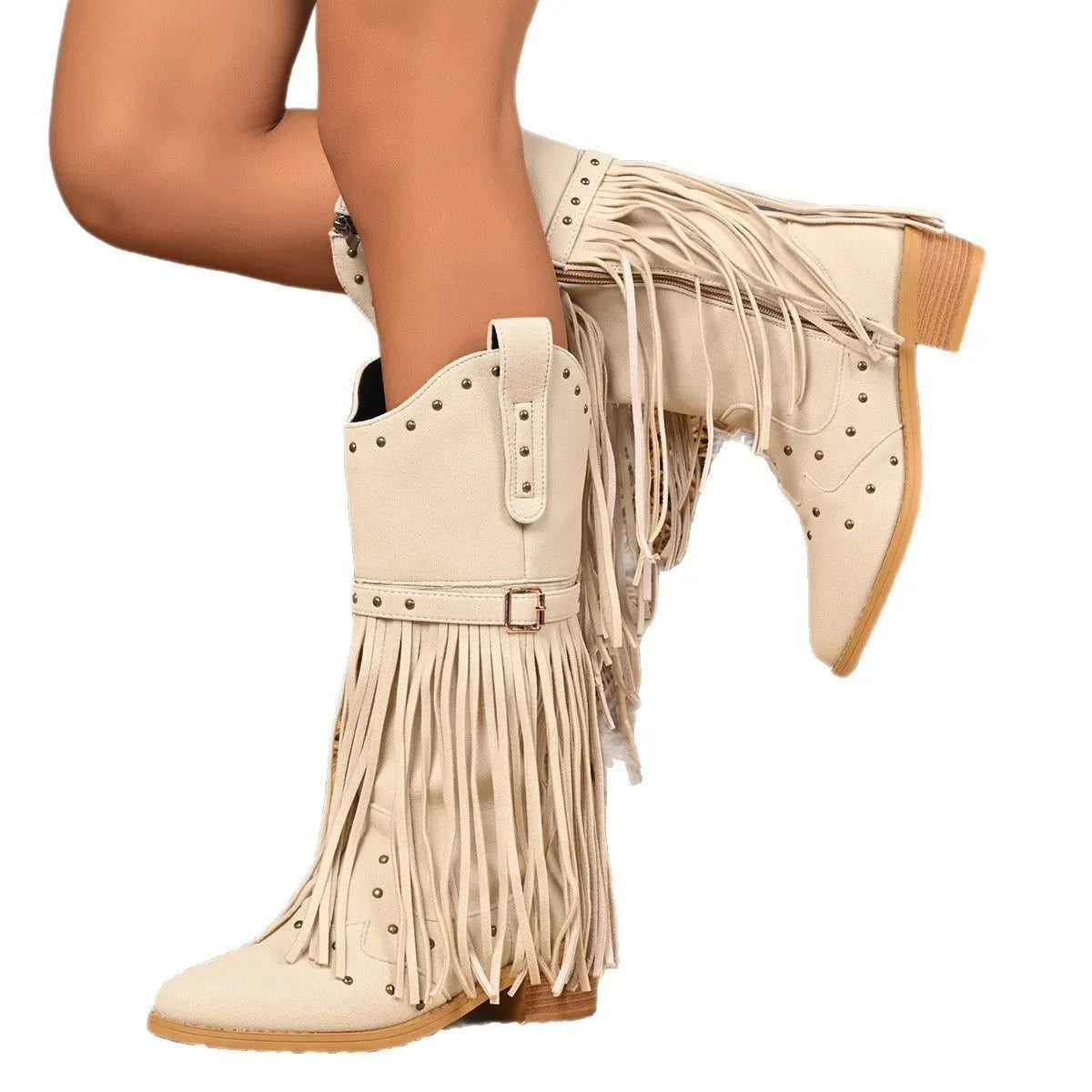 Beige women's western cowboy boots with mid heel, side zipper, and tassel details on a white background