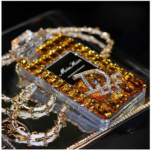 iPhone case with perfume bottle bow design, TPU silicone construction, and attached metal chain