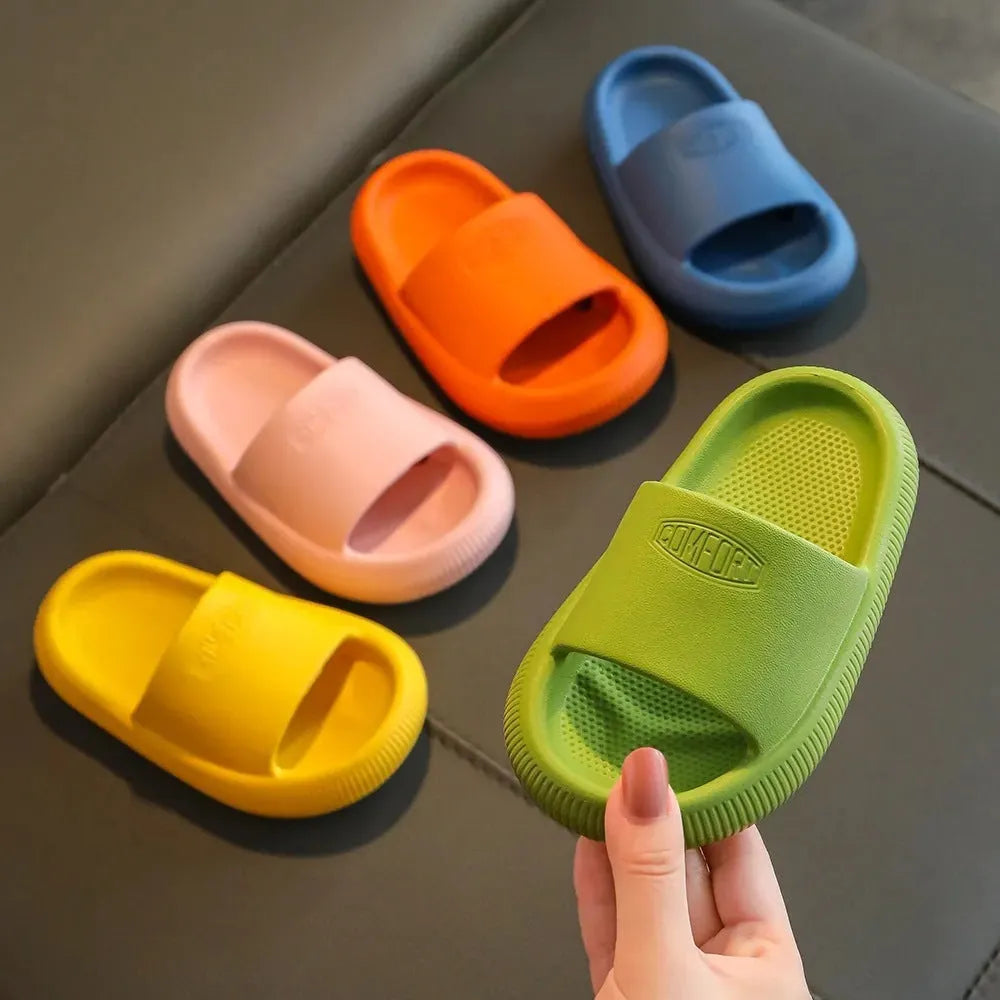 Children's colourful EVA slippers with a non-slip sole, shown in blue, green, orange, pink, and yellow.
