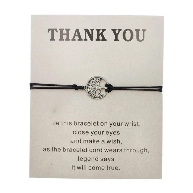 Hand-woven red rope Tree of Life bracelet with adjustable sizing