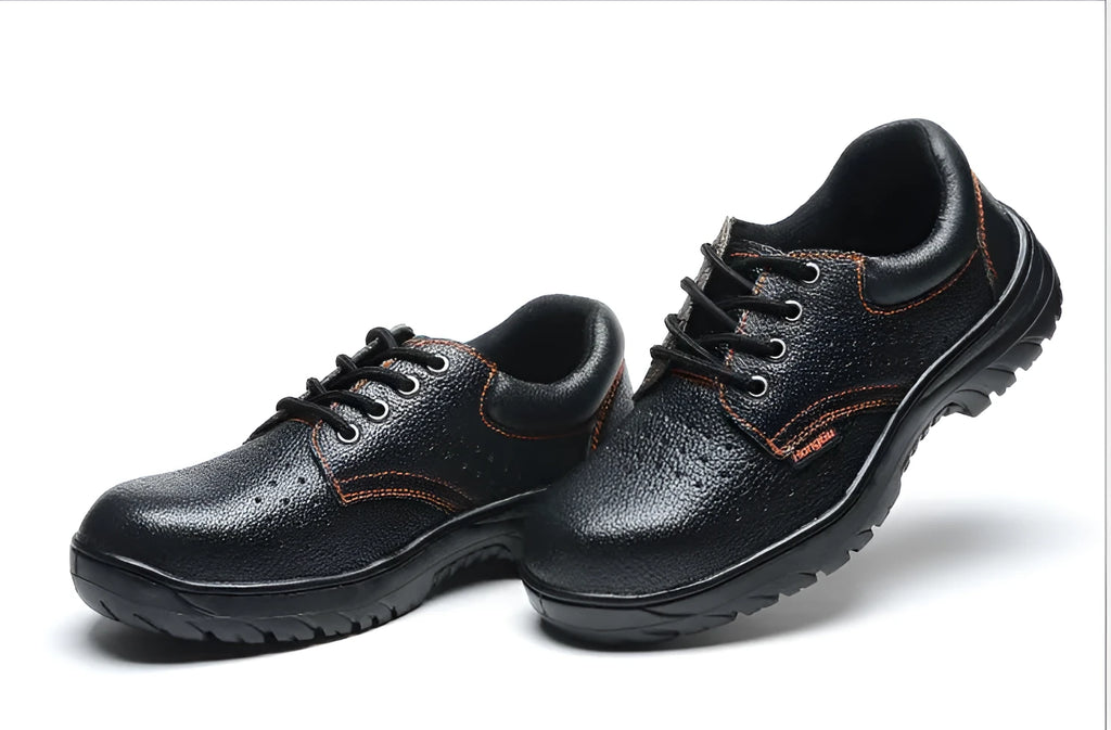 Black embossed cowhide safety shoes with steel toe cap and antiskid outsole on concrete floor