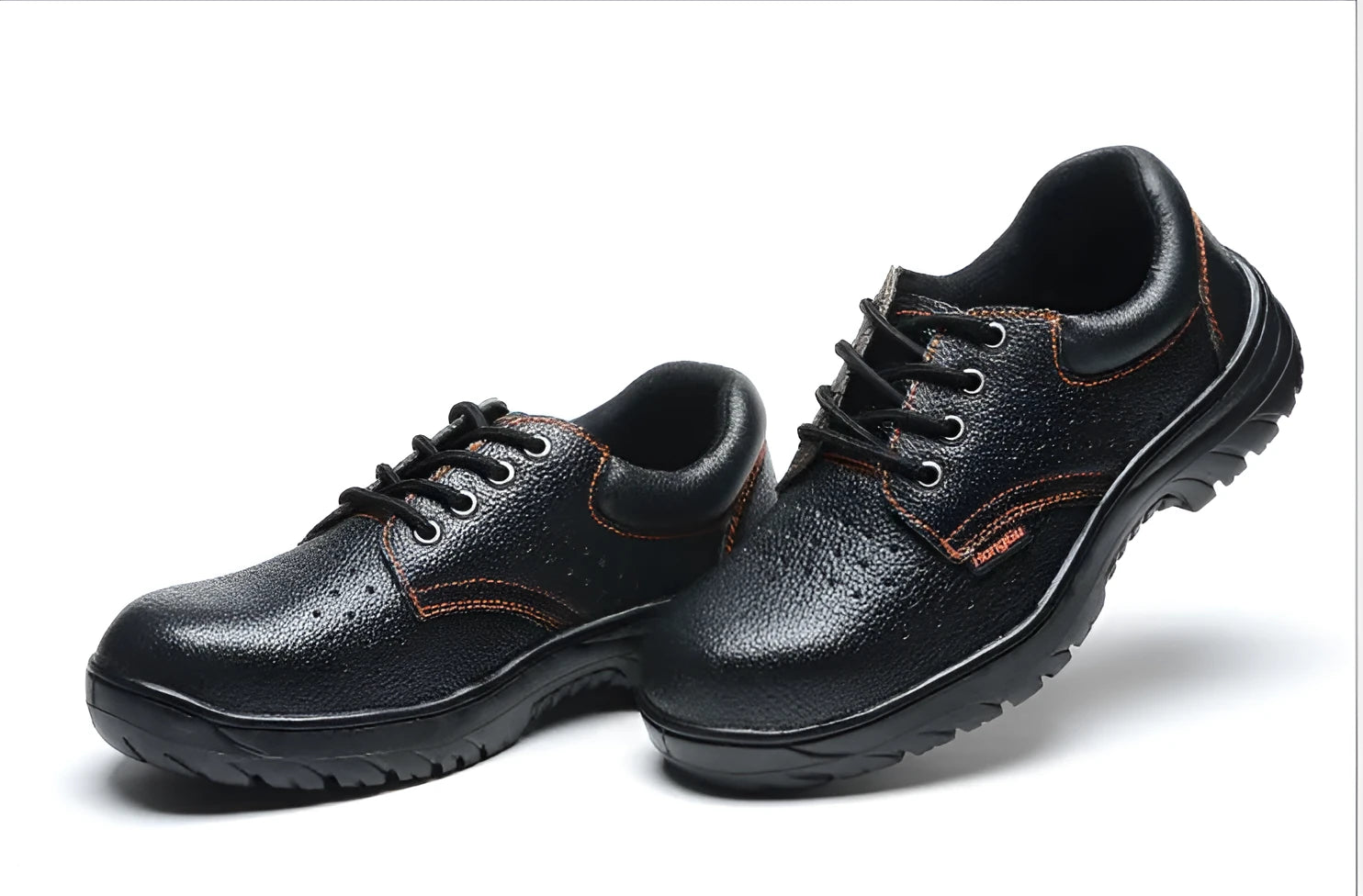 Black embossed cowhide safety shoes with steel toe cap and antiskid outsole on concrete floor
