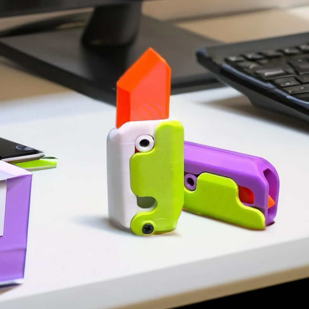 3D printed carrot gravity fidget knife in orange purple green colour, showing blade partly extended from sheath