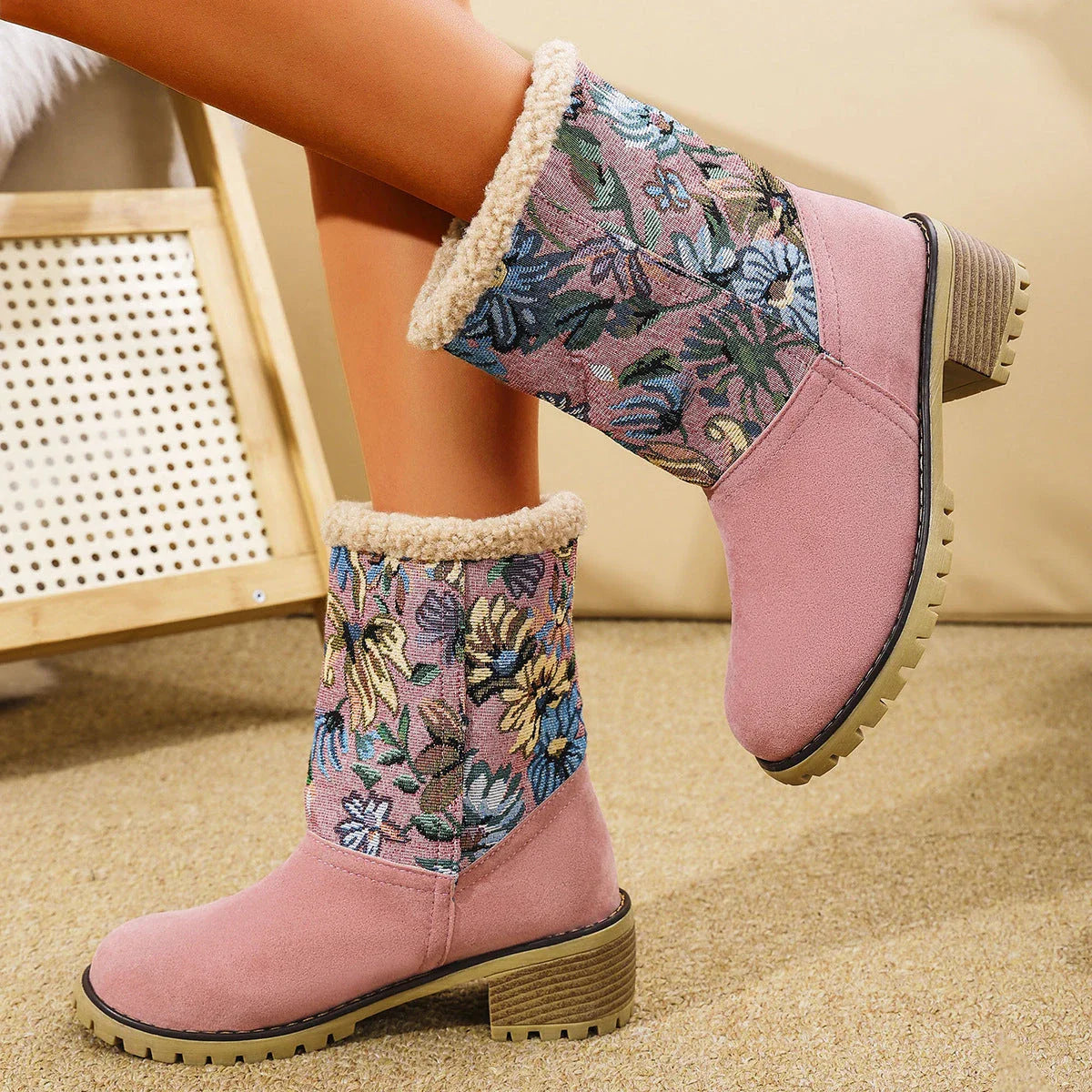 Stylish ethnic-inspired snow boots with floral embroidery, featuring a warm cotton interior and durable suede exterior in a variety of colors.