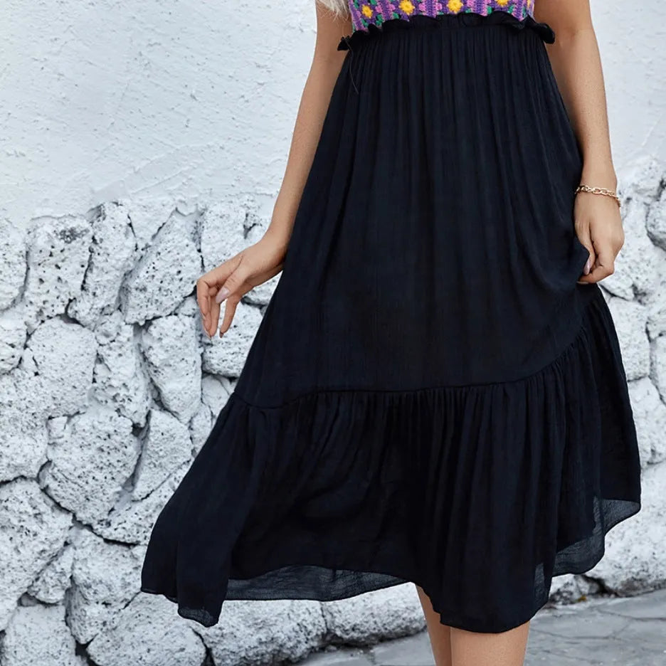 Purple sleeveless dress with detailed hand-hooked flower stitching on the fabric.
