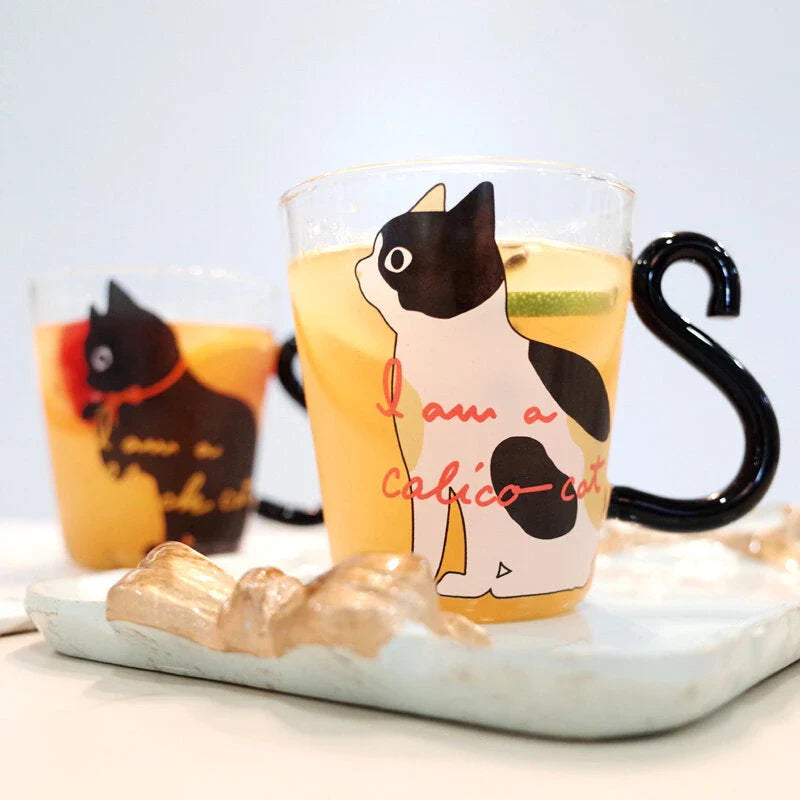 Adorable cat-themed glass mug with tail-shaped handle, perfect for hot and cold beverages