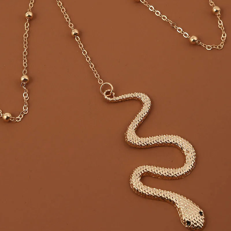 Gold metal beaded chain thigh chain with big snake pendant for women