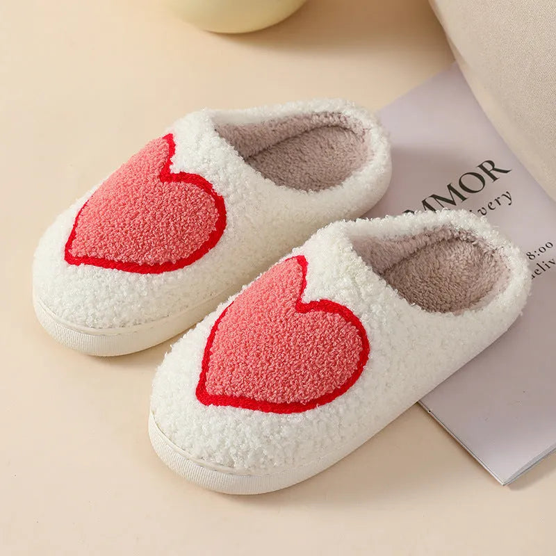 Women's plush home slippers with cartoon love design, round toe, and non-slip PVC sole