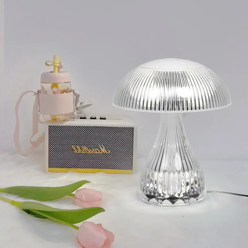 Small white USB rechargeable touch night lamp with three colour changing LED light.