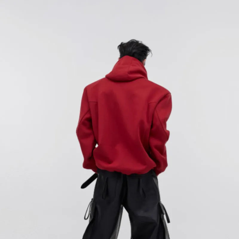 Men's loose red hooded sweater with heavy shoulder pads and raised three-dimensional printing pattern.