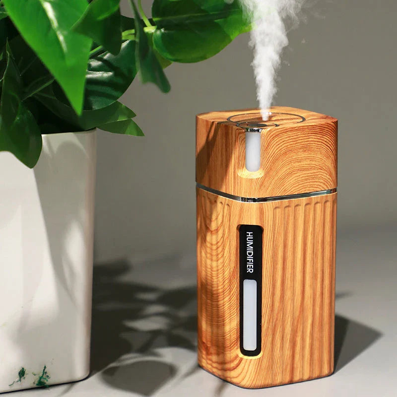 Versatile wood grain ultrasonic humidifier with aroma diffuser, LED light, and compact design