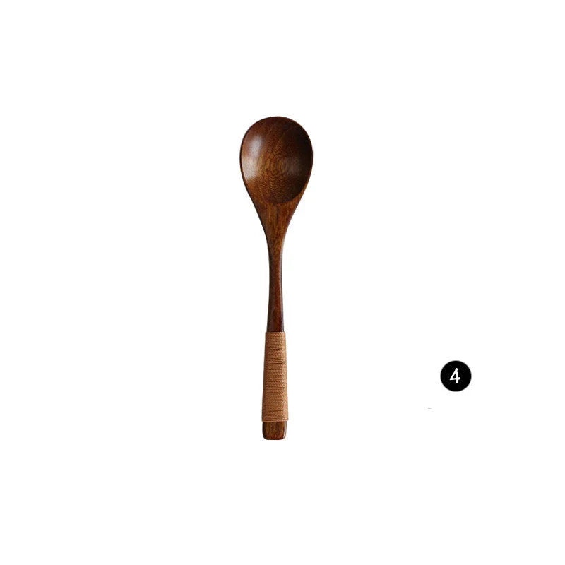 Japanese-style wooden bamboo spoon and fork set on a wooden table