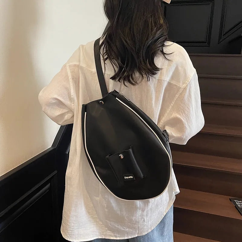 Black one-shoulder yoga storage bag with large main compartment and breathable lining