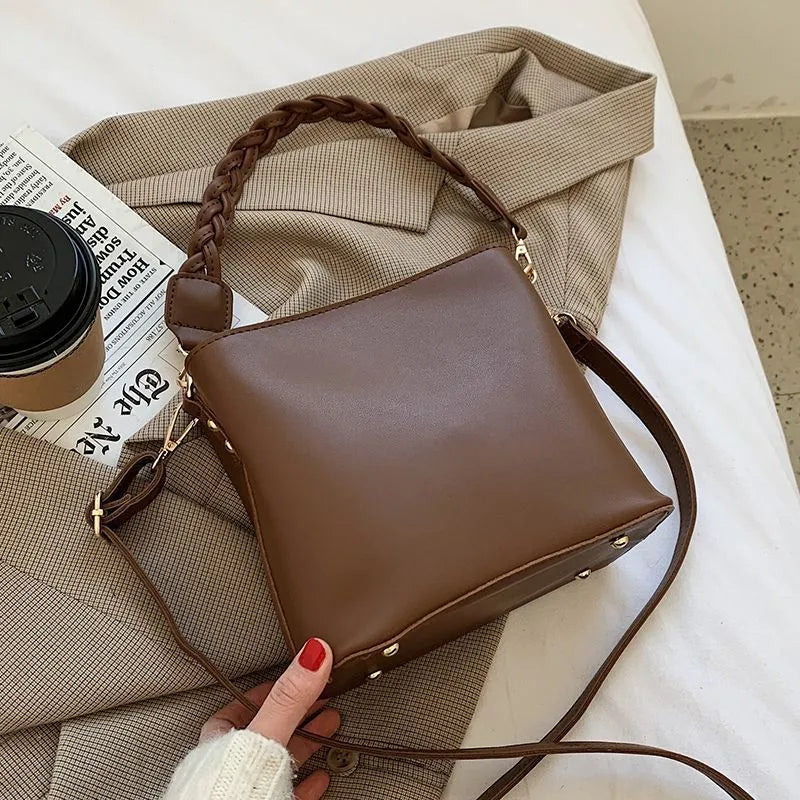 Retro woven PU one-shoulder crossbody underarm bucket bag in khaki colour.